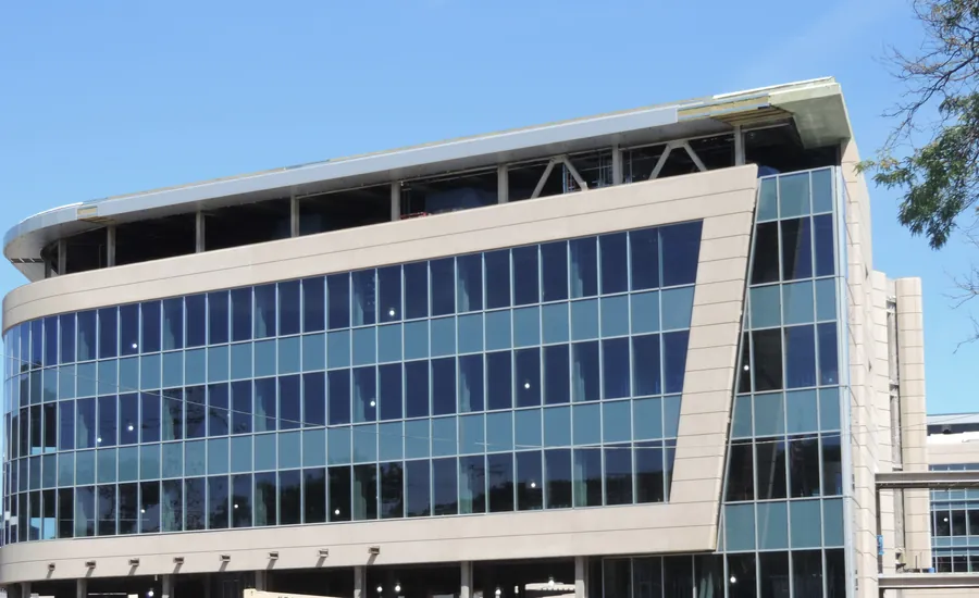 Modern multi-story commercial office building with a glass facade